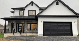 black garage doors on white house